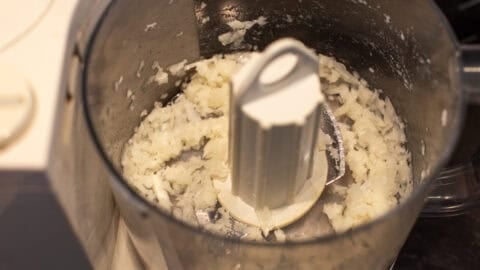 Finely chopped onion in a food processor.