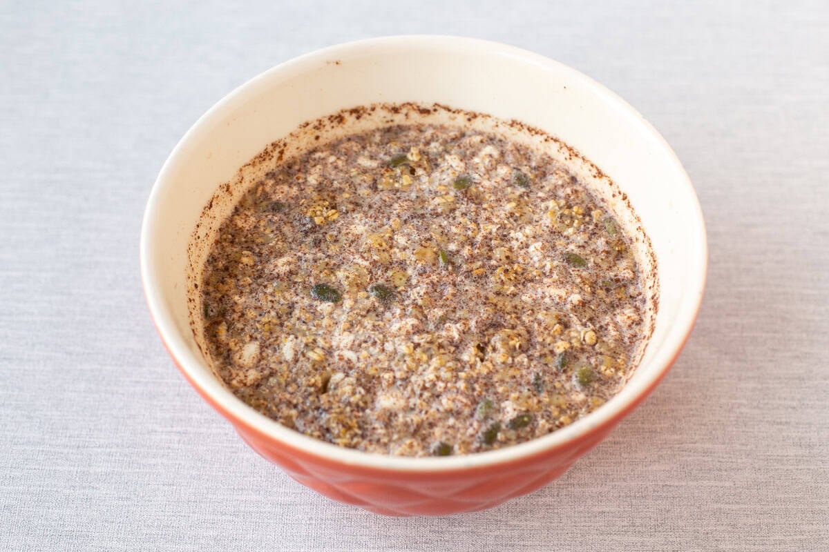 High protein overnight oats in a large bowl after the ingredients have settled overnight.