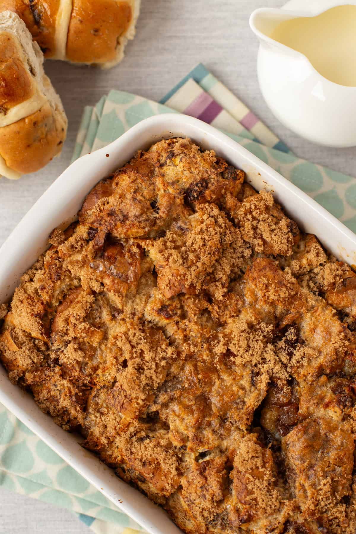 Overhead shot of bread and butter pudding with a crispy brown sugar topping.