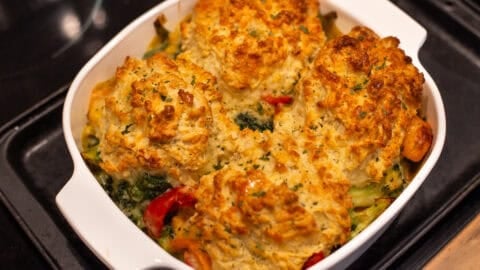 Vegetable cobbler topped with crispy cheese scones.