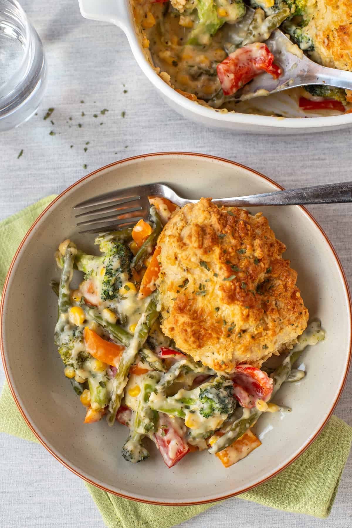 Vegetable cobbler topped with crispy cheese scone.