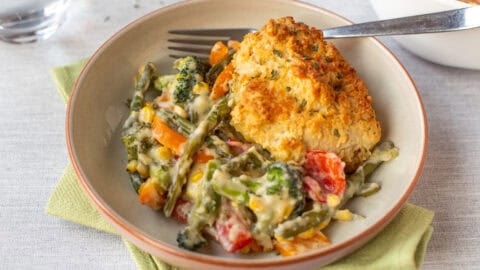 Vegetable cobbler topped with crispy cheese scone.