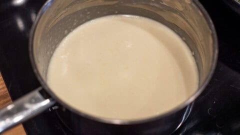 White sauce in a saucepan.
