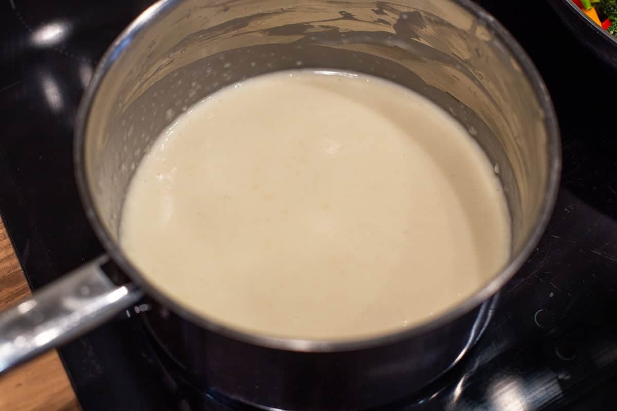 White sauce in a saucepan.