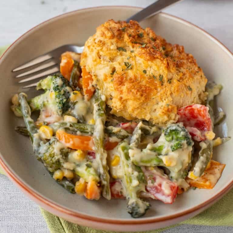 Vegetable cobbler topped with crispy cheese scones.