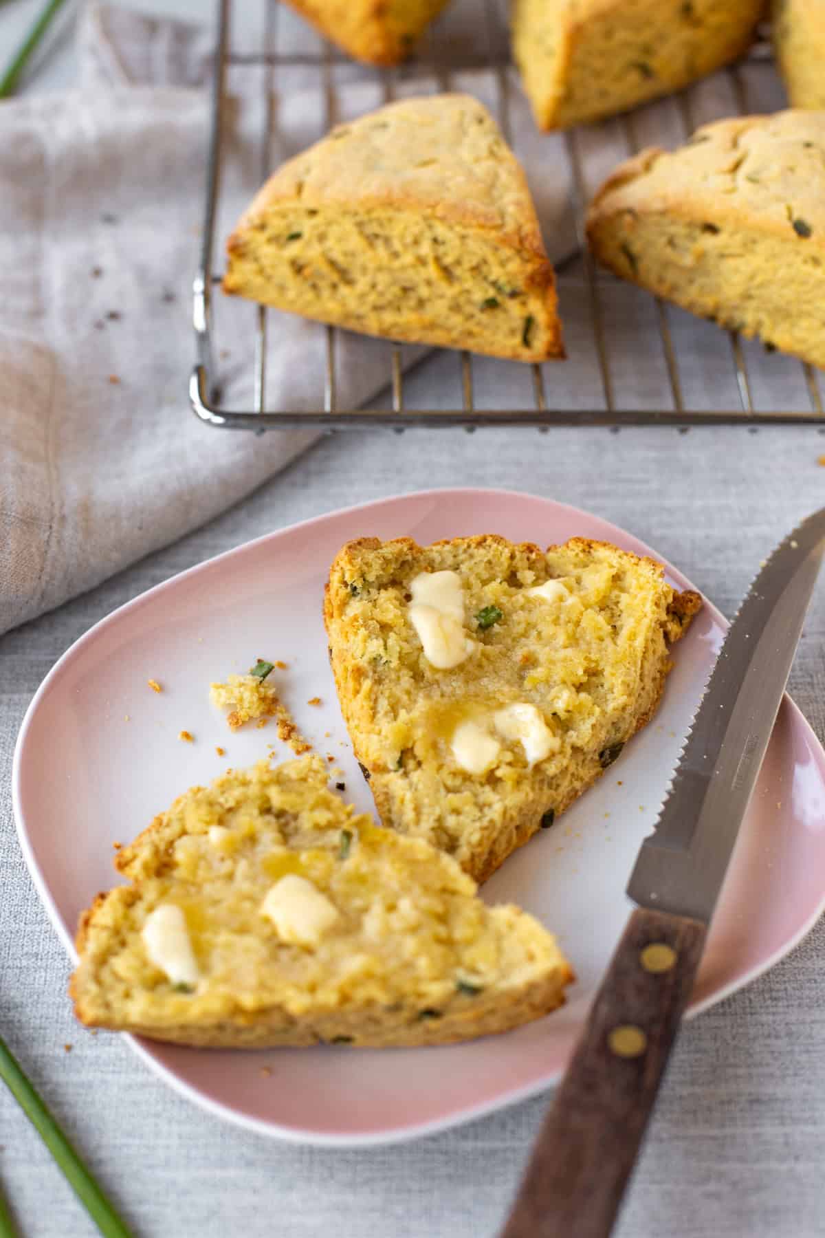 An easy hummus scone cut in half and spread with melting butter.