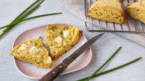 An easy hummus scone cut in half and spread with butter.