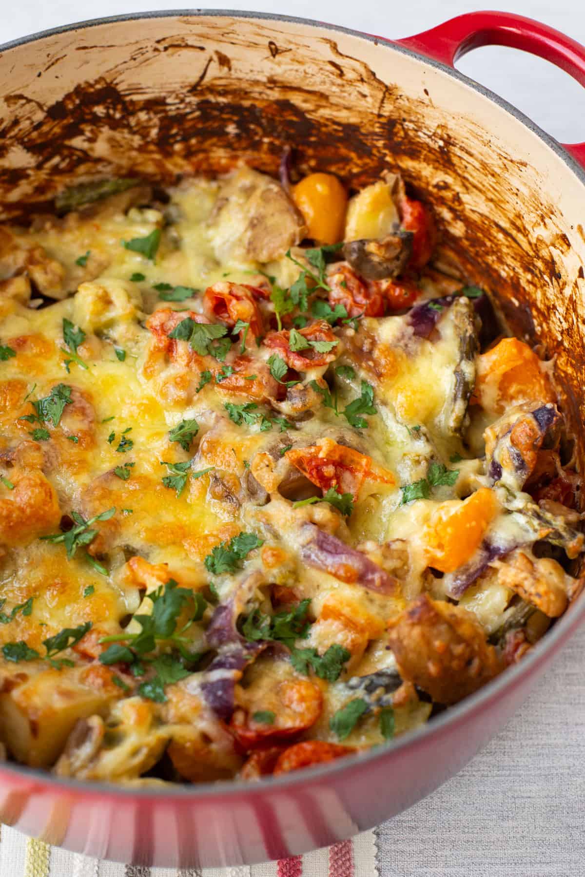 A large pot of cheesy vegetable potato bake.