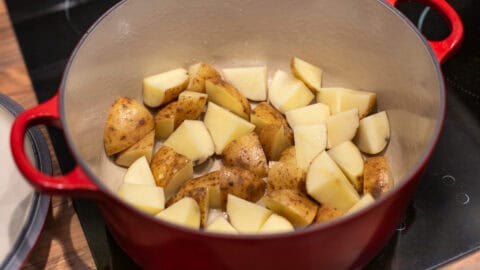 Chopped potatoes in a large pot.
