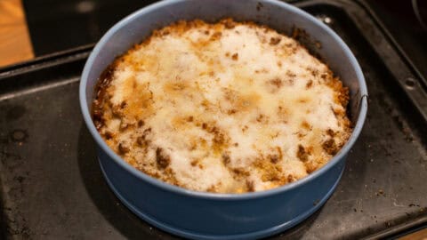 Easy apple crumble cake in a cake tin.