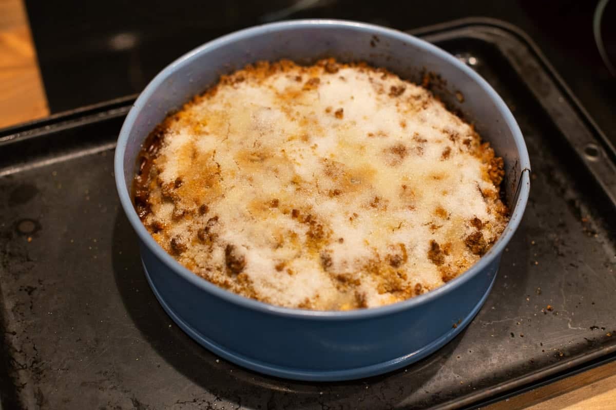 Easy apple crumble cake in a cake tin.