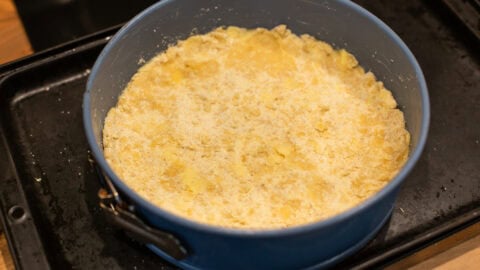 Easy crumble mixture pressed into a springform cake tin.