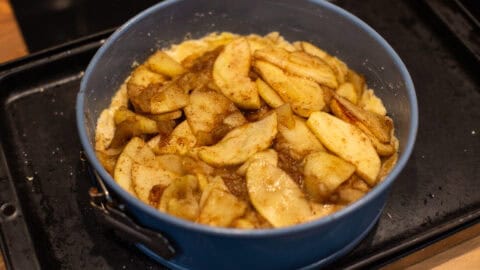 Spiced apples in a cake tin.