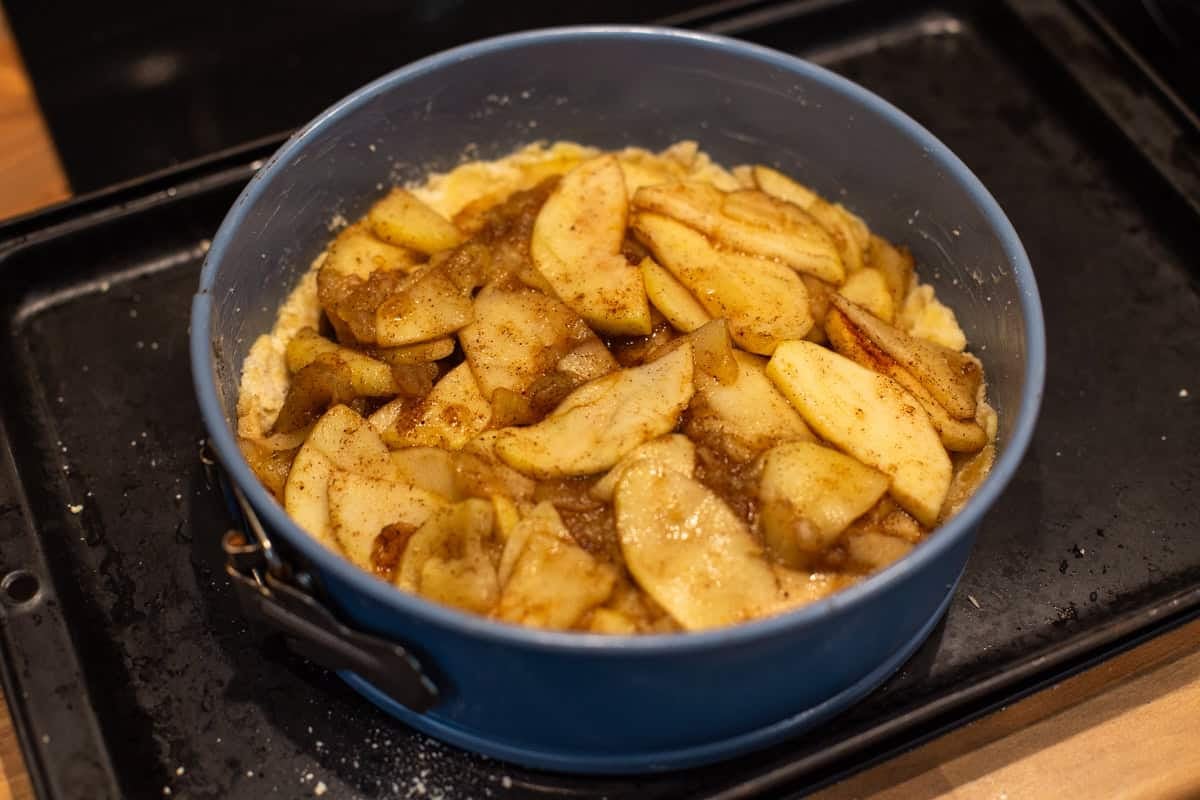 Spiced apples in a cake tin.