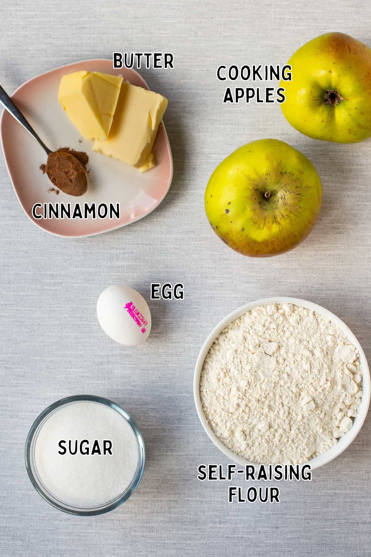 Ingredients for easy apple crumble cake laid out with text overlay.