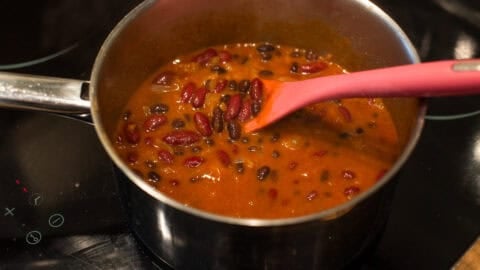 Easy kidney bean curry cooking in a saucepan.
