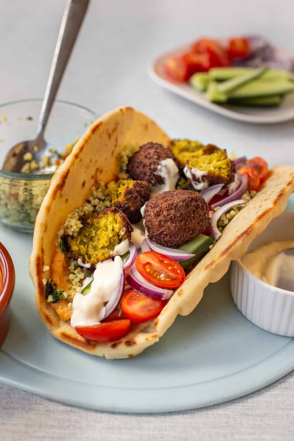 An easy tabbouleh and falafel wrap stuffed with vegetables and hummus.