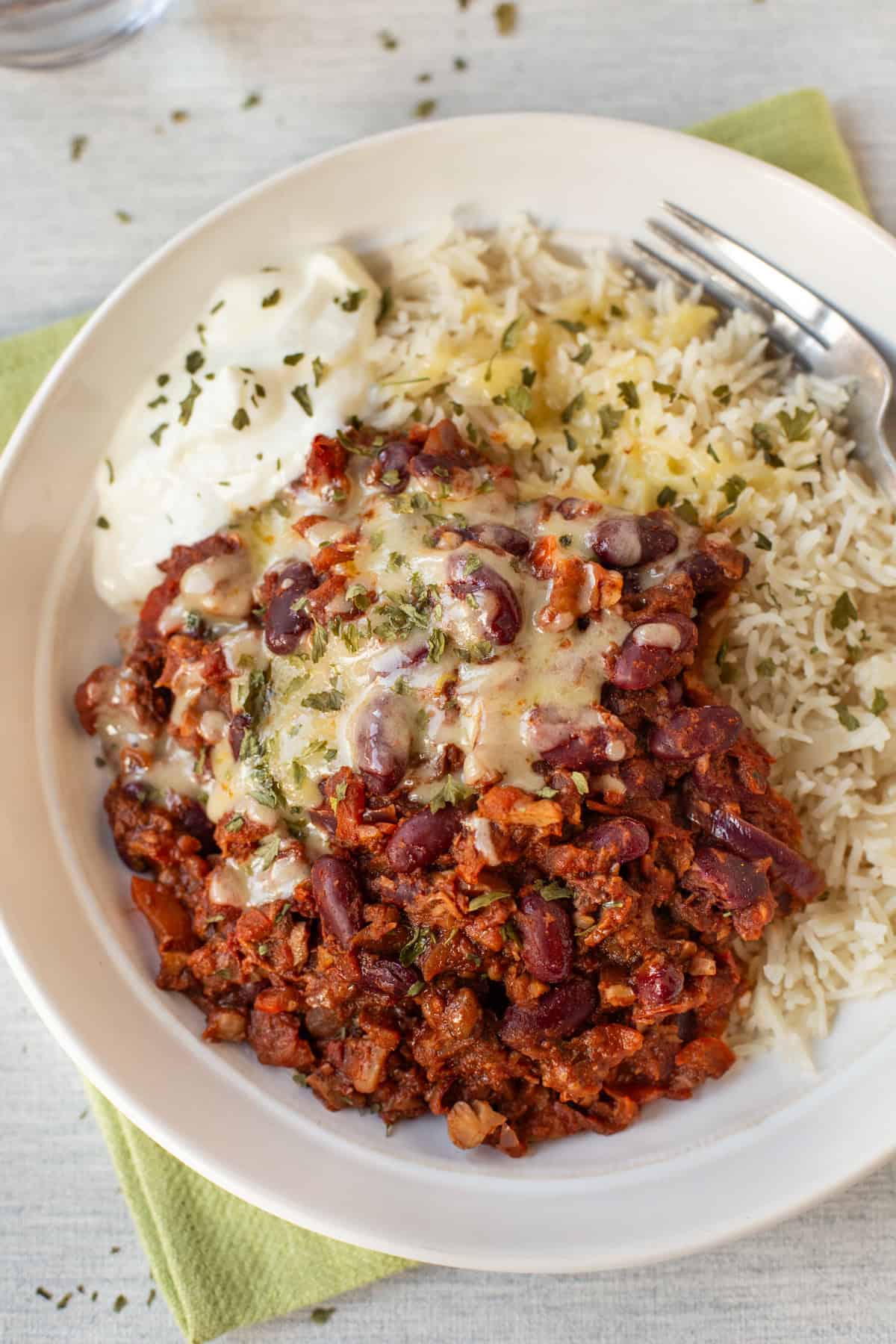 Overhead shot of a bowl of vegetarian chilli and rice.