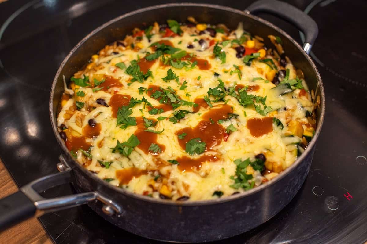 A pan of cheesy enchilada orzo.