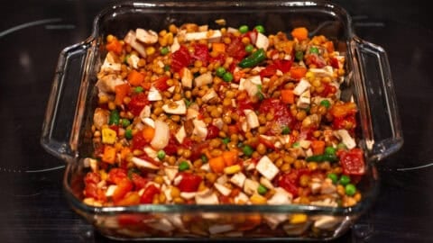 Lentil and vegetable mixture in a baking dish.
