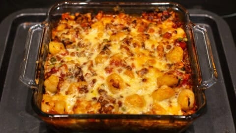 Cheesy baked gnocchi in a baking dish.