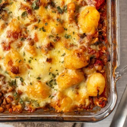 Close up of vegetarian shepherd's pie gnocchi in a baking dish.