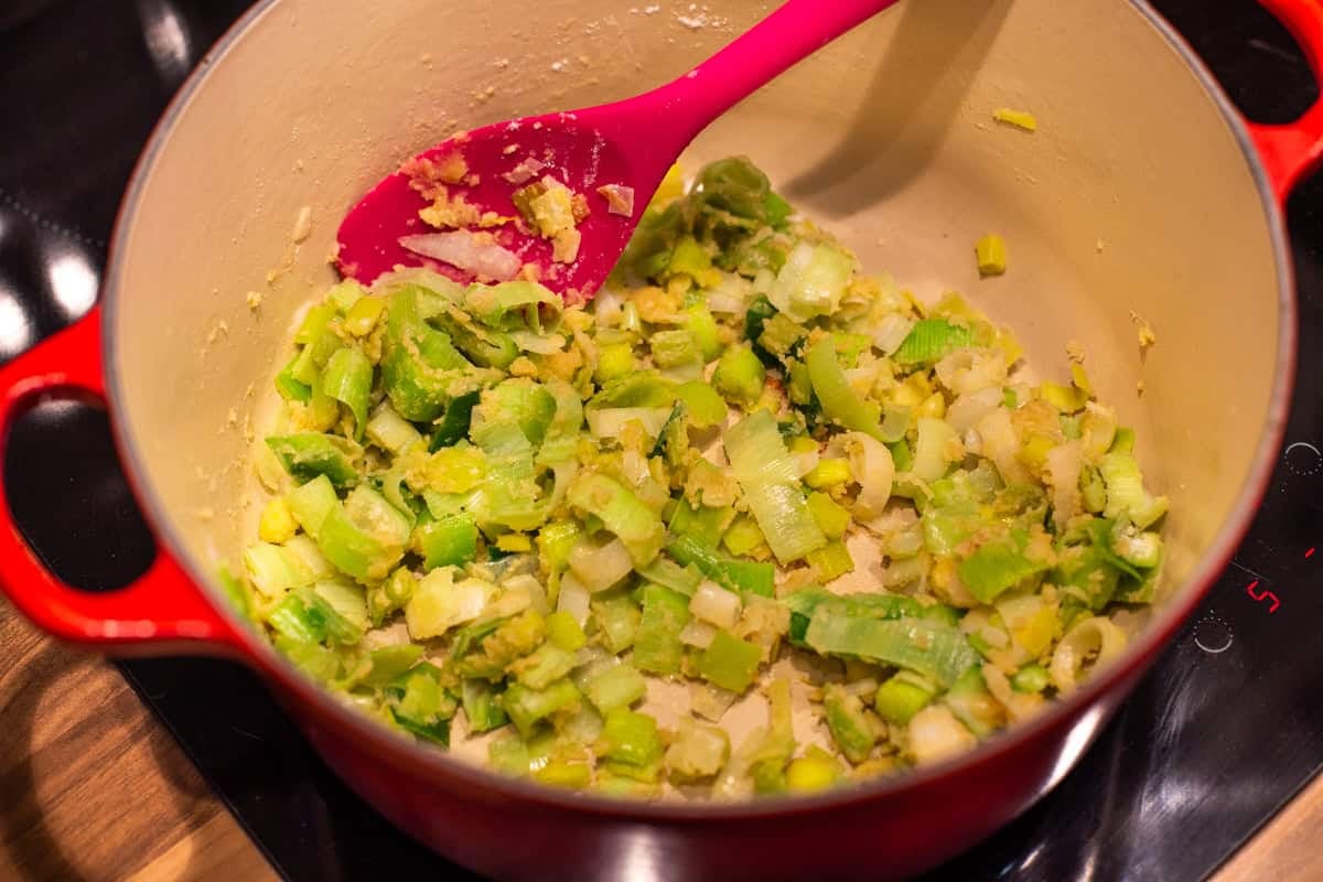 Sautéed leeks and flour in a large pot.