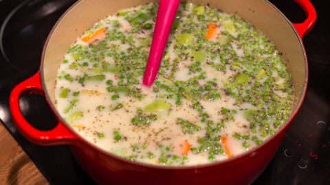 Vegetables and a creamy sauce in a large pot.