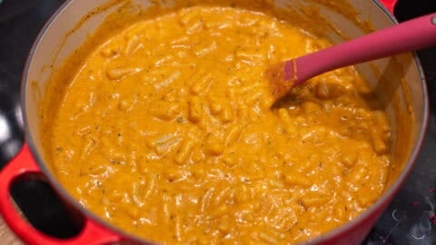 Creamy pumpkin mac and cheese in a large pot.