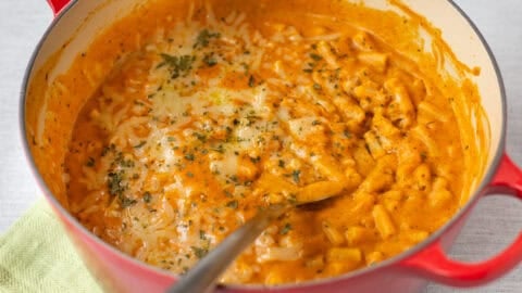 Cheesy pumpkin mac and cheese in a large pot.