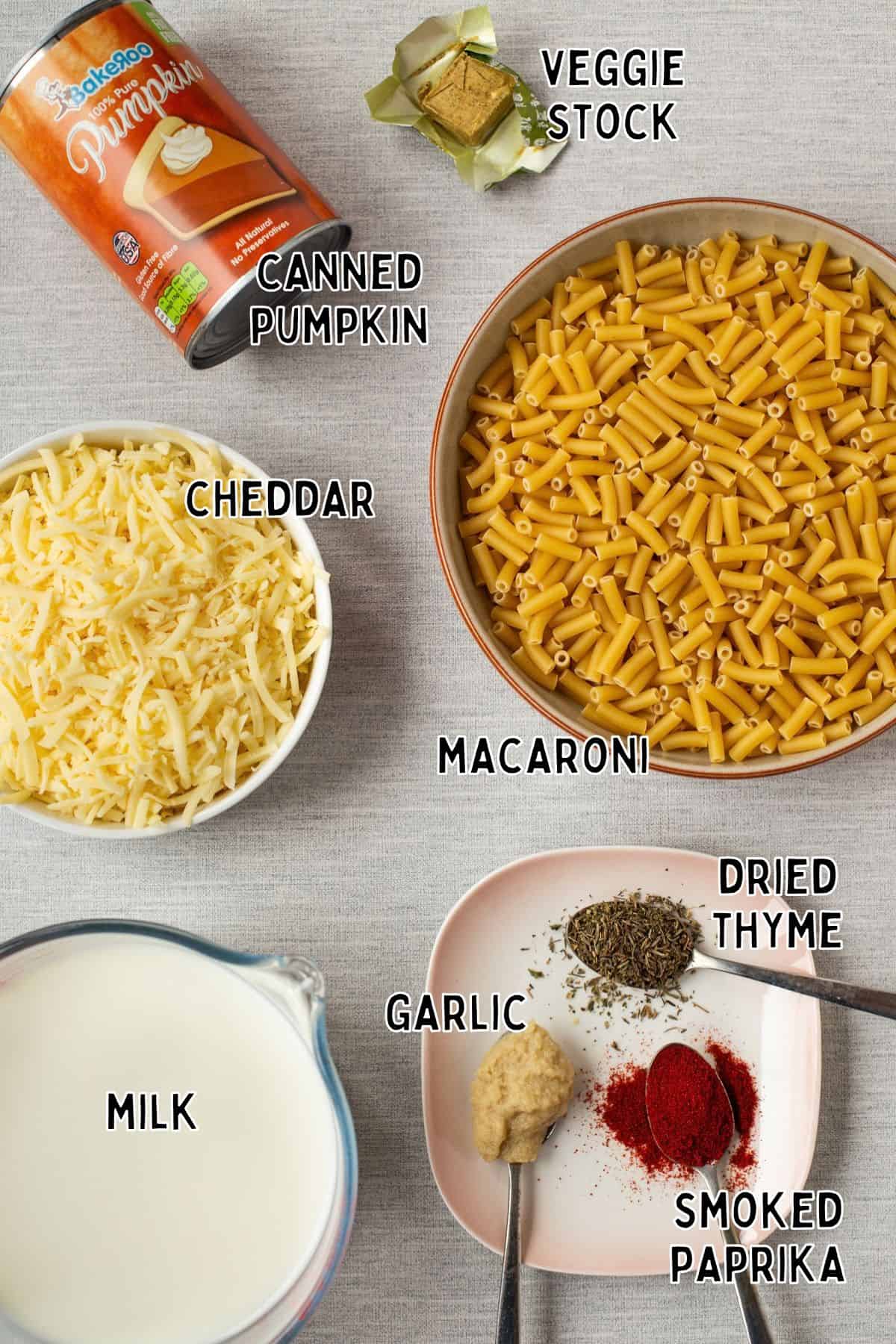 Ingredients for one pot pumpkin mac and cheese laid out with text overlay.