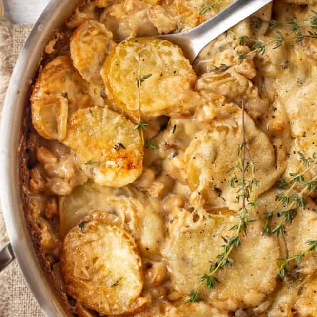 Overhead shot of creamy French onion potato bake in a pan.